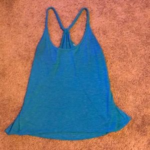 Loose fitting razor back blue tank top with rope strap.